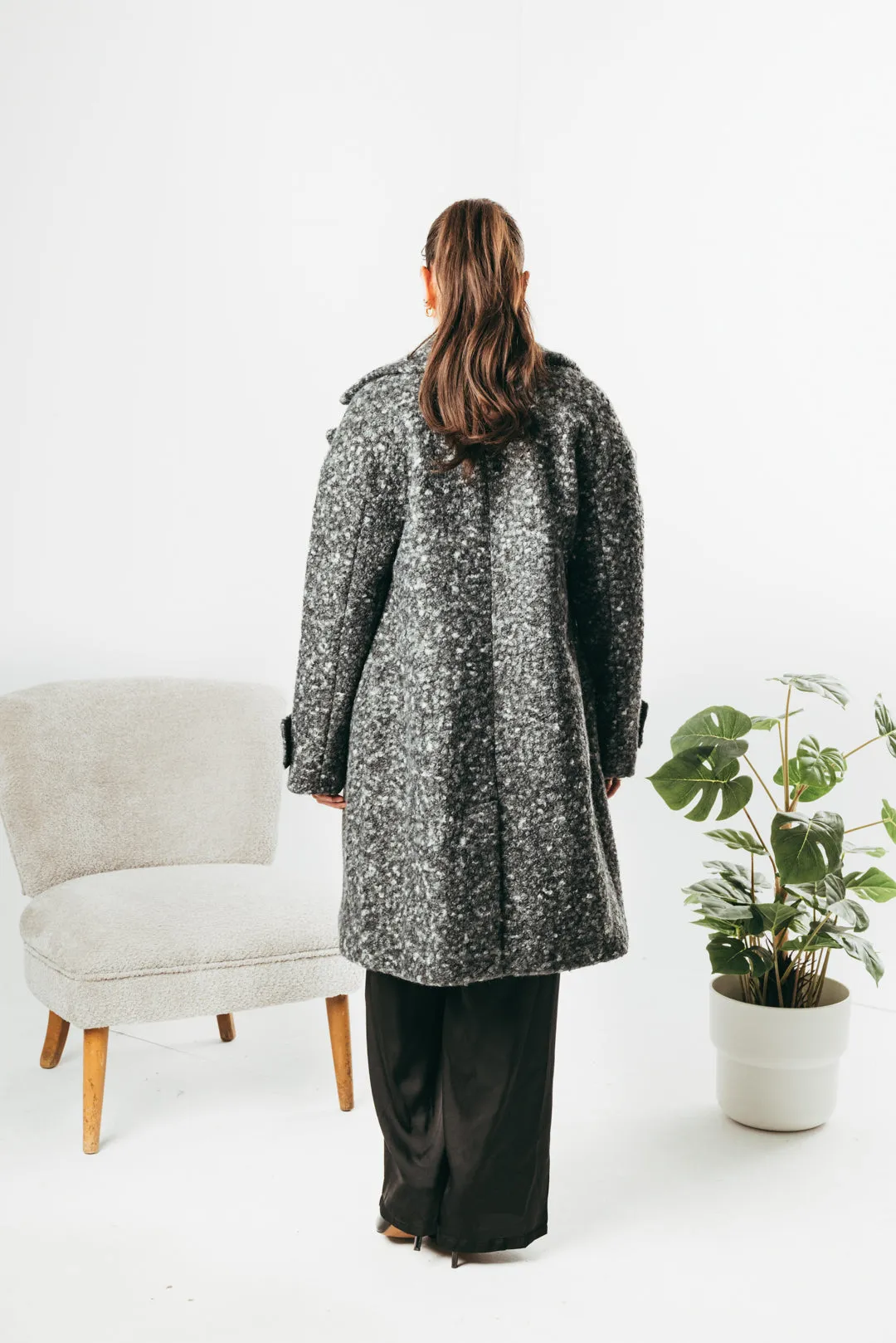 Long coat with decorative buttons on the sleeve